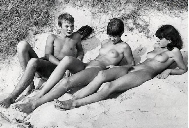 Beautiful naked young nudists retro photo